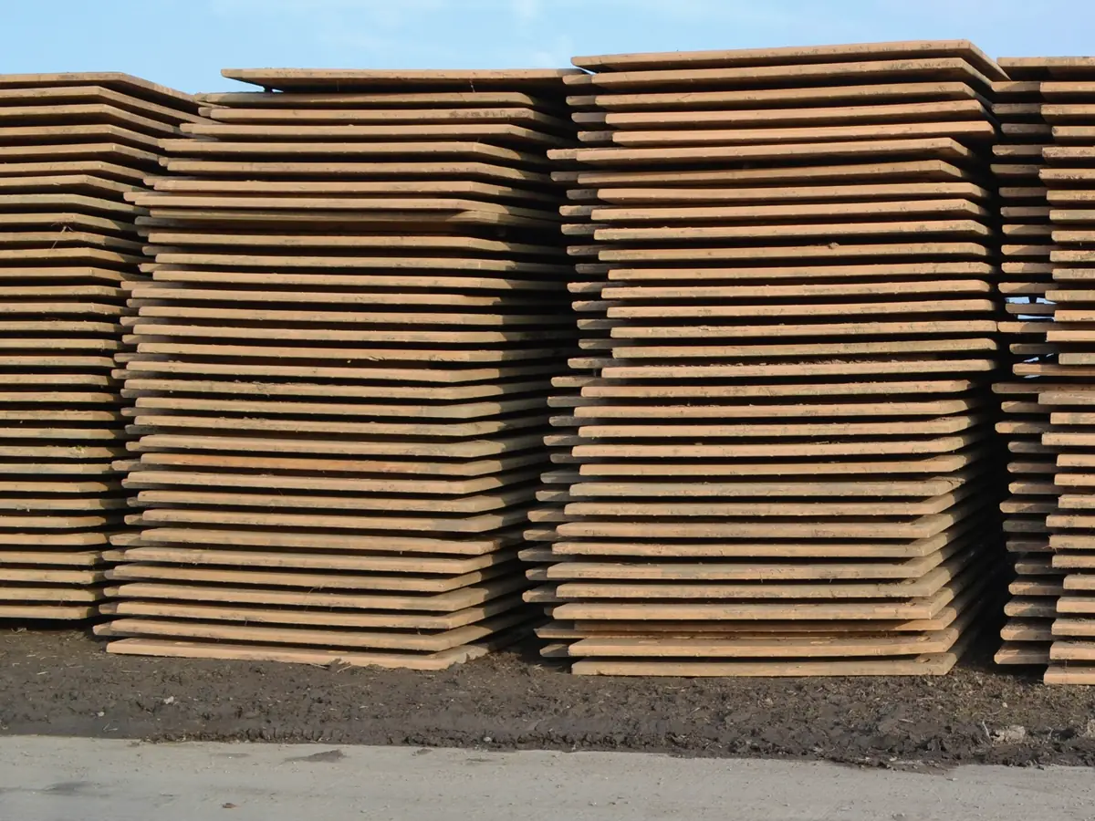 Illustrative image of stacked steel plates in a stockyard (not Jayesh Steel stock)